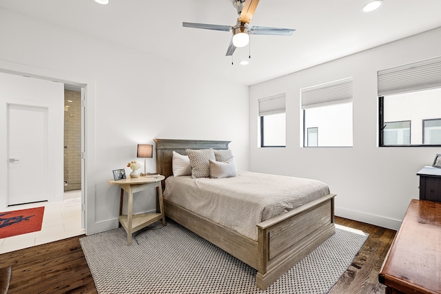 bedroom featuring baseboards, recessed lighting, and wood finished floors