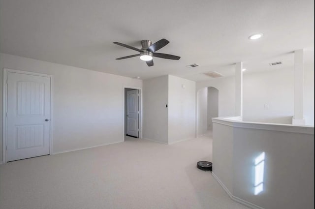 1101 Riverstone Trl, Princeton, TX 75407 - unfurnished room featuring light colored carpet, ceiling fan, visible vents, and arched walkways