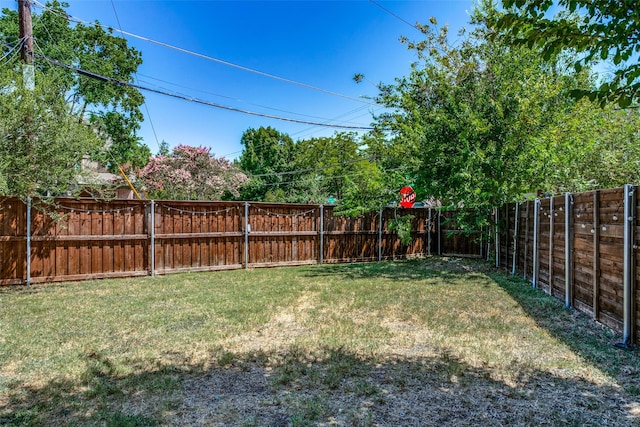 view of yard with a fenced backyard