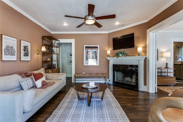 living room with recessed lighting, wood finished floors, ceiling fan, and a fireplace