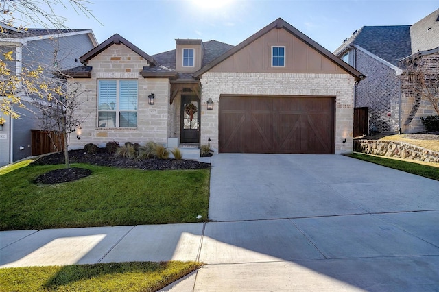 view of front of property with a front lawn, a garage, stone siding, board and batten siding, and concrete driveway