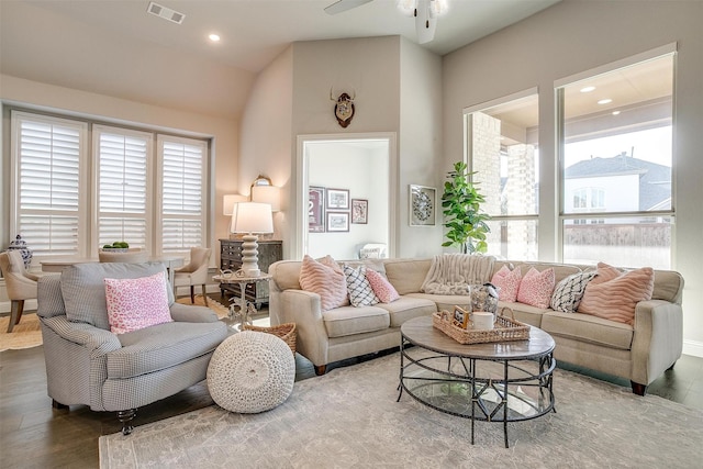living area with recessed lighting, wood finished floors, ceiling fan, visible vents, and lofted ceiling