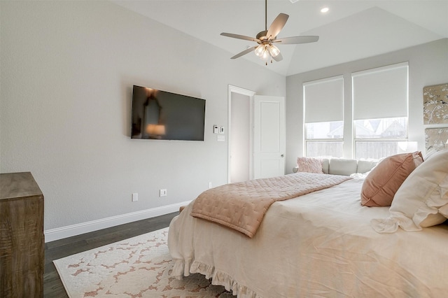 bedroom featuring lofted ceiling, dark wood-type flooring, ceiling fan, and baseboards