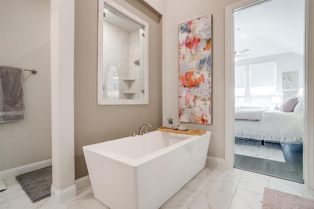bathroom with ensuite bath, baseboards, a ceiling fan, a freestanding bath, and marble finish floor