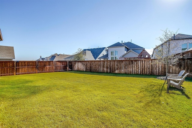view of yard featuring a fenced backyard