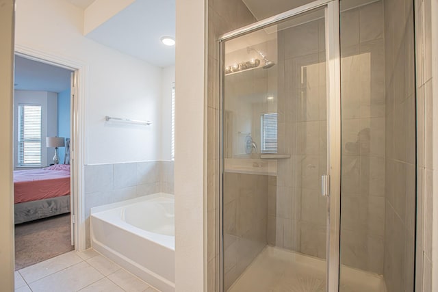 full bath with a garden tub, a stall shower, tile patterned flooring, and ensuite bathroom