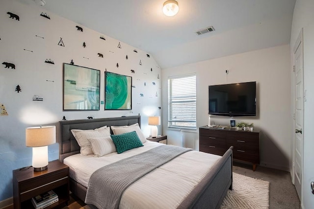 bedroom with visible vents, light carpet, lofted ceiling, and baseboards