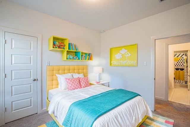 carpeted bedroom featuring baseboards