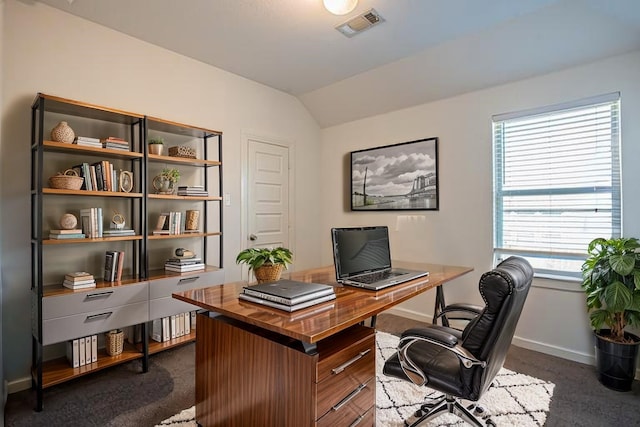 office space with lofted ceiling, visible vents, and baseboards