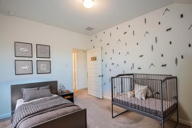 bedroom featuring light colored carpet, visible vents, and baseboards