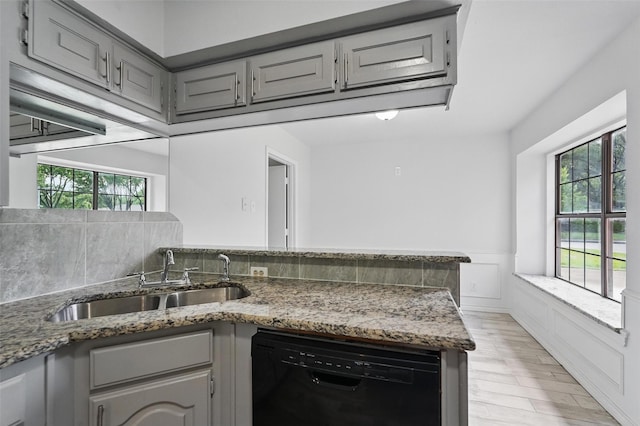 829 Hunters Creek Dr, Desoto, TX 75115 - kitchen featuring a wealth of natural light, dishwasher, gray cabinets, and a sink