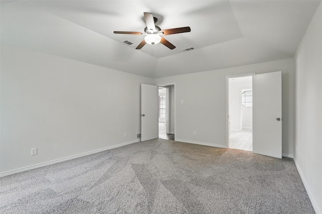 829 Hunters Creek Dr, Desoto, TX 75115 - carpeted empty room featuring baseboards, visible vents, a raised ceiling, and a ceiling fan