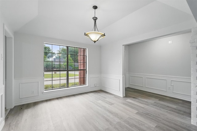 829 Hunters Creek Dr, Desoto, TX 75115 - unfurnished room featuring wood finished floors, a decorative wall, and wainscoting