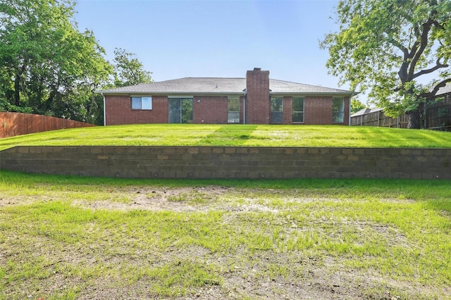 829 Hunters Creek Dr, Desoto, TX 75115 - back of house with brick siding, fence, and a chimney