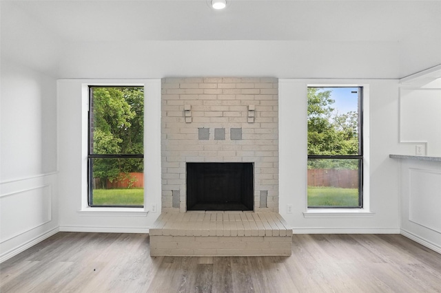 829 Hunters Creek Dr, Desoto, TX 75115 - unfurnished living room with a fireplace and wood finished floors