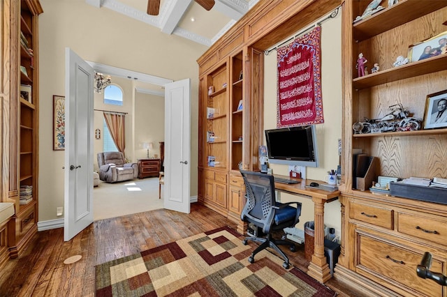 office area with beamed ceiling, ceiling fan, built in features, baseboards, and wood finished floors