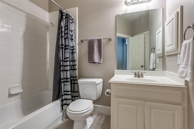 full bath featuring shower / bathtub combination with curtain, vanity, tile patterned floors, toilet, and a textured wall