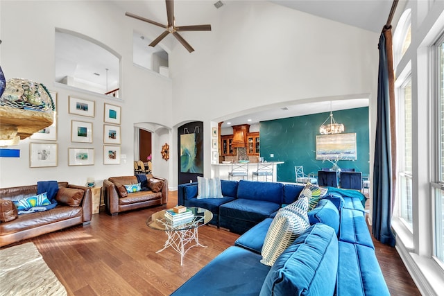 3040 N Camino Lagos, Grand Prairie, TX 75054 - living room featuring a towering ceiling, a ceiling fan, arched walkways, and wood finished floors