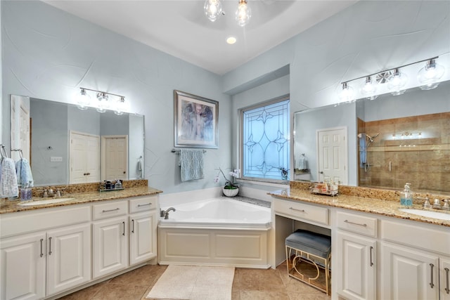 3040 N Camino Lagos, Grand Prairie, TX 75054 - bathroom featuring two vanities, a shower stall, tile patterned flooring, and a sink