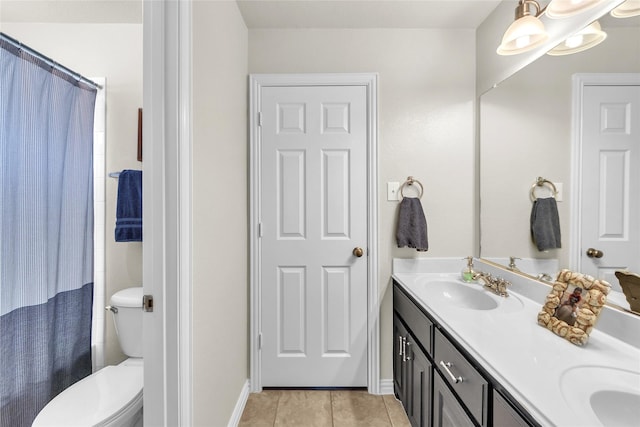 3040 N Camino Lagos, Grand Prairie, TX 75054 - bathroom featuring curtained shower, a sink, double vanity, toilet, and tile patterned flooring