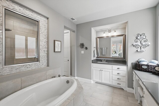 1078 Cabinside Dr, Roanoke, TX 76262 - full bath with a garden tub, visible vents, vanity, and a healthy amount of sunlight