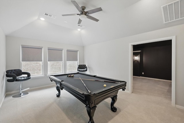 rec room featuring visible vents, light carpet, ceiling fan, and vaulted ceiling