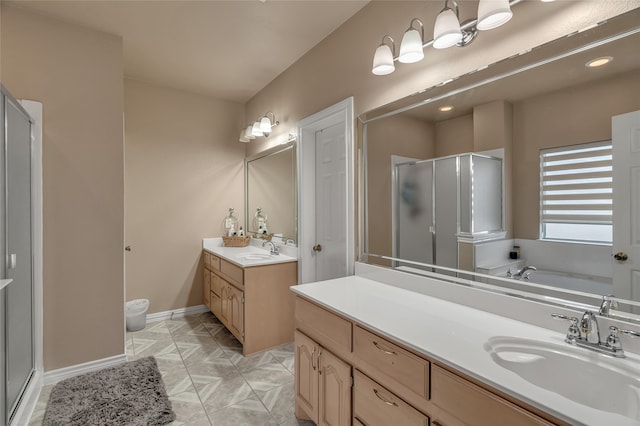 full bath with vanity, a shower stall, a bath, and baseboards