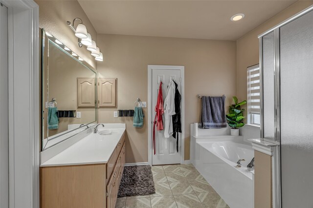 full bathroom with recessed lighting, vanity, tile patterned floors, baseboards, and a garden tub