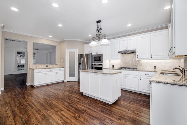 kitchen featuring a sink, decorative backsplash, stainless steel appliances, under cabinet range hood, and white cabinets