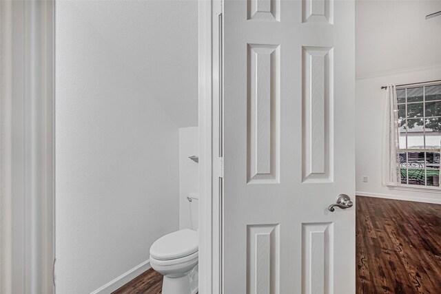 827 Huebner Way, Burleson, TX 76028 - bathroom featuring wood finished floors, baseboards, and toilet