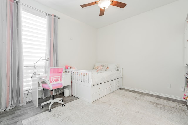 bedroom featuring wood finished floors and ceiling fan