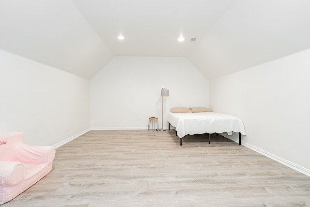 bedroom featuring recessed lighting, vaulted ceiling, light wood-style flooring, and baseboards