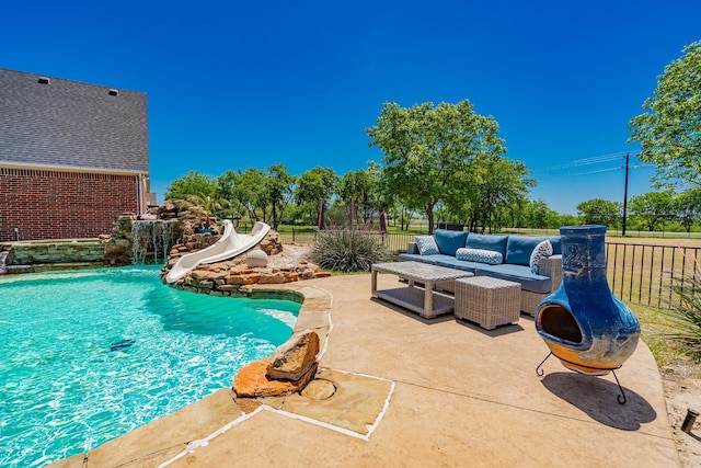 view of swimming pool with a patio area, a fenced in pool, fence private yard, outdoor lounge area, and a water slide