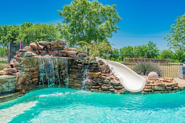 view of pool with fence