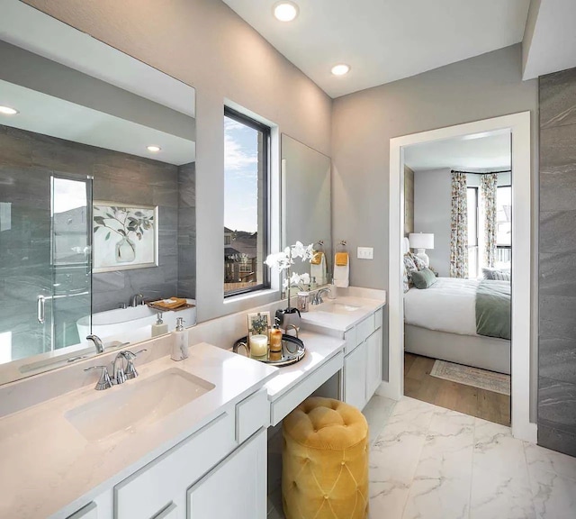 full bath with a wealth of natural light, a shower stall, and recessed lighting