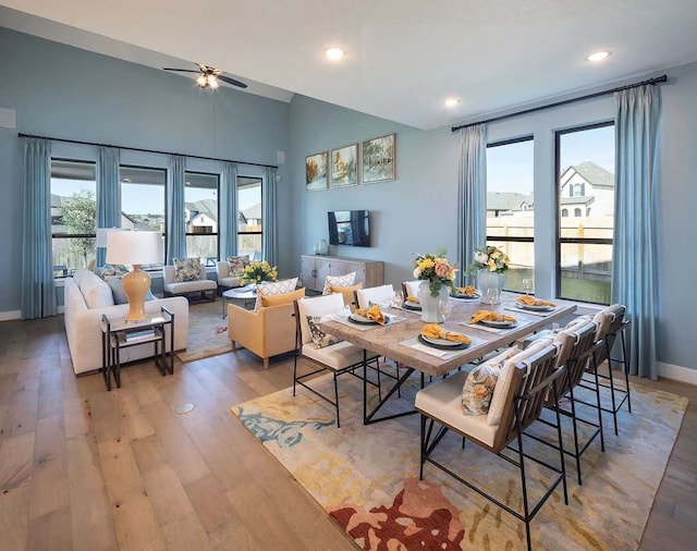 dining space featuring ceiling fan, recessed lighting, light wood-style flooring, and baseboards