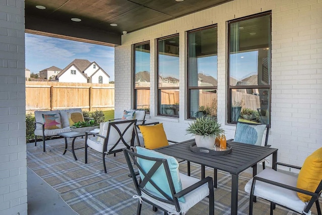 exterior space featuring outdoor dining space, a patio area, and an outdoor hangout area
