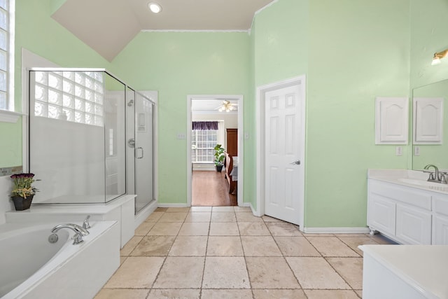 9318 Waterview Pkwy, Rowlett, TX 75089 - bathroom featuring vanity, a shower stall, a garden tub, baseboards, and high vaulted ceiling