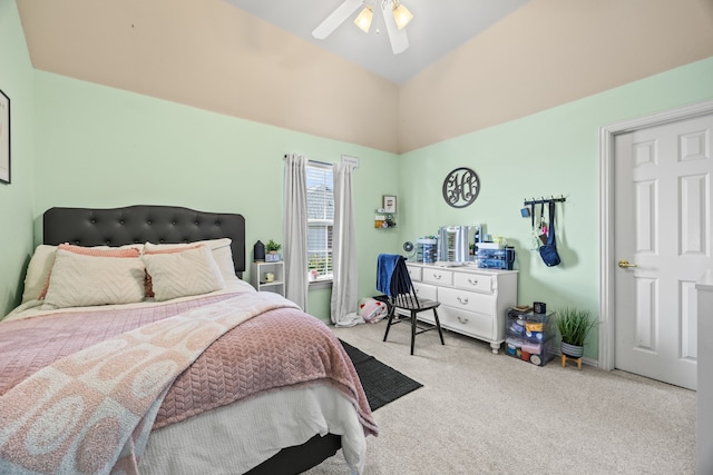 bedroom with carpet flooring, a ceiling fan, and high vaulted ceiling