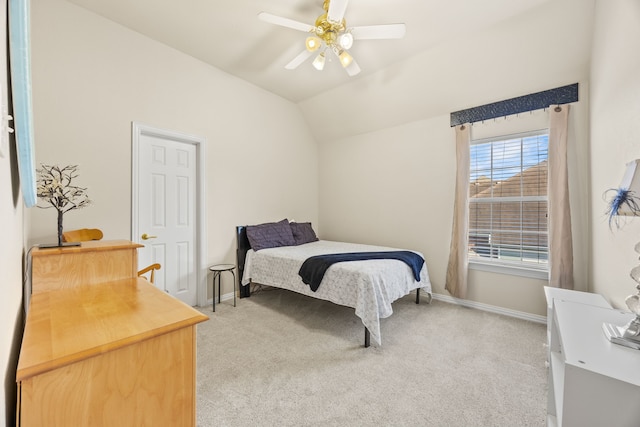 bedroom featuring baseboards, ceiling fan, lofted ceiling, and light colored carpet
