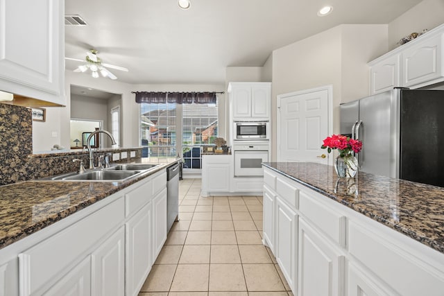 9318 Waterview Pkwy, Rowlett, TX 75089 - kitchen featuring appliances with stainless steel finishes, a sink, white cabinets, ceiling fan, and recessed lighting