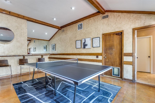 recreation room with visible vents, vaulted ceiling with beams, and concrete floors