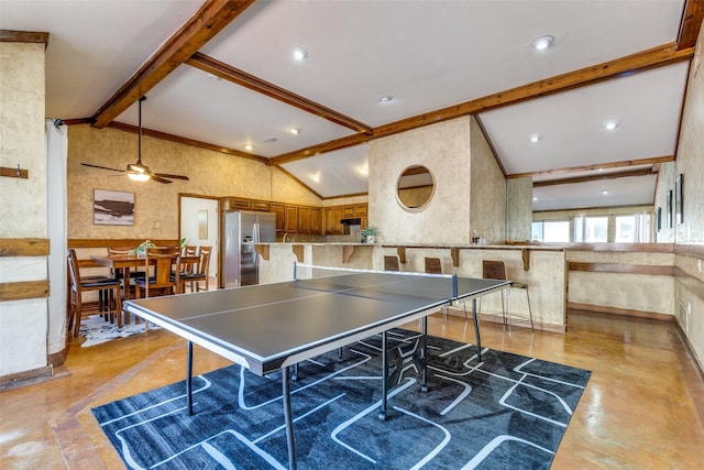 rec room featuring ceiling fan, finished concrete floors, ornamental molding, and vaulted ceiling with beams