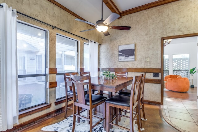 dining space featuring a ceiling fan and tile patterned flooring