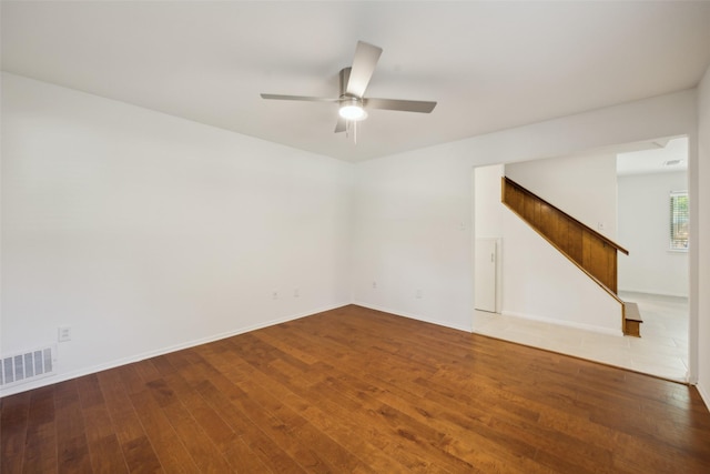 10714 Palace Way, Dallas, TX 75218 - entryway featuring stairway, baseboards, ceiling fan with notable chandelier, and visible vents
