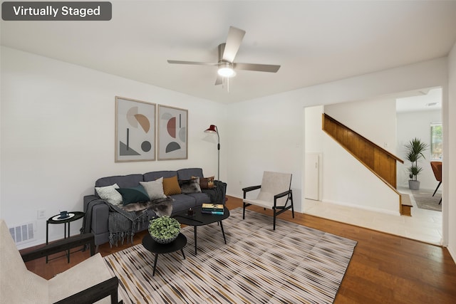 10714 Palace Way, Dallas, TX 75218 - empty room with ceiling fan, hardwood / wood-style flooring, baseboards, visible vents, and stairway