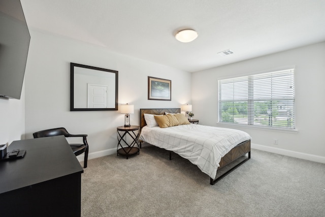 bedroom with visible vents, carpet, and baseboards