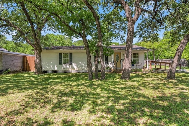 back of house with fence and a lawn