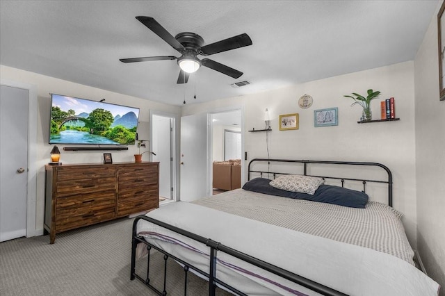 bedroom with visible vents, ceiling fan, carpet flooring, and baseboards