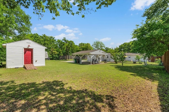 view of yard with an outdoor structure and a fenced backyard